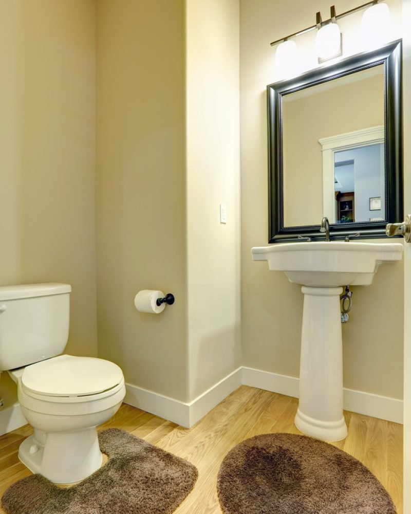 View,Of,Small,Bathroom,With,White,Toilet,And,Washbasin,Stand.